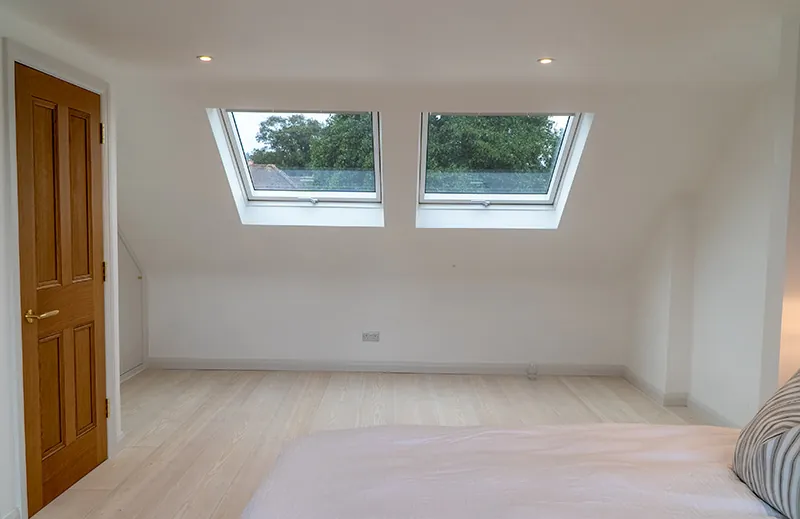 Loft bedroom with twin rooflights